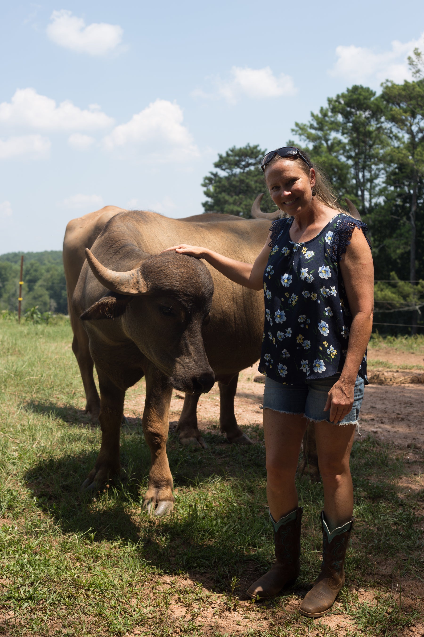 Shalley with a water buffalo on the family farm in Georgia